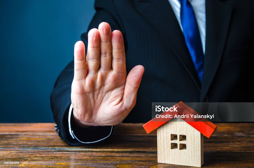Refusal to provide housing. Bank refuse to give a mortgage loan. Low credit score. Confiscation of pledged property. Building commissioning. Building codes. Cancellation of deal buying real estate Forbidden Stock Photo