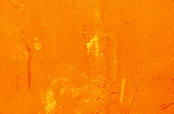 istock A surface of old shabby orange plaster. 1357661273