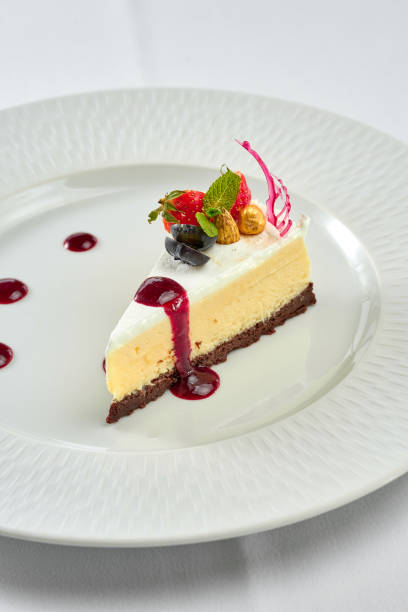 istock Cheesecake with sauce in a white plate on a white plate 1357662170