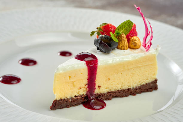 istock Cheesecake with sauce in a white plate on a white plate 1357662182