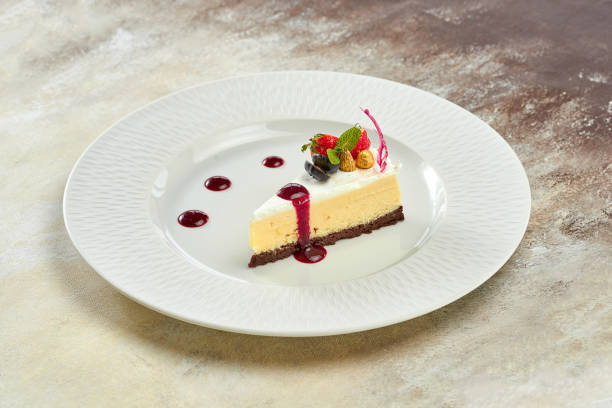 istock Cheesecake with sauce in a white plate on a white plate 1357662183