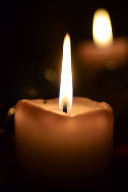 istock Burning beige candles as a close up 1357662784