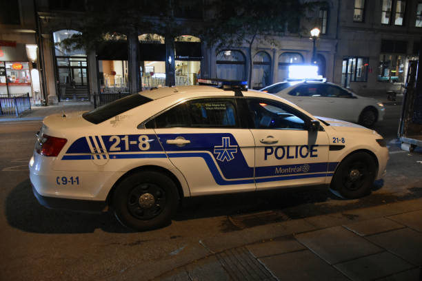 Montreal, Police Land Vehicle, Quebec, Canada, Building Exterior Montreal Police Land Vehicle, Building Exterior, Retail Store Scene In The Night In Montreal Quebec Canada police station canada stock pictures, royalty-free photos & images
