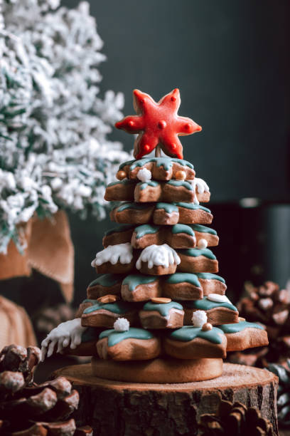 istock Gingerbread Christmas tree on dark table, Christmas card 1357666499
