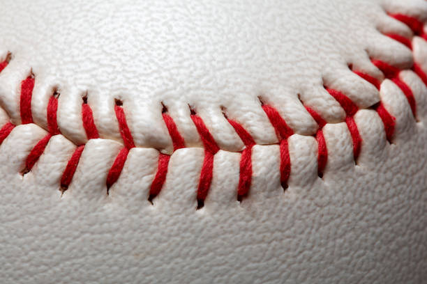 istock Macro close-up baseball ball with stiches and seam 1357666871