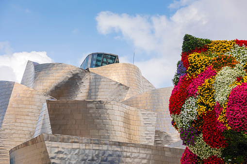 Bilbao, Spain - August 2, 2021: close-up of the facade of the Guggenheim Museum Bilbao, a museum of modern and contemporary art, designed by architect Frank Gehry in 1997