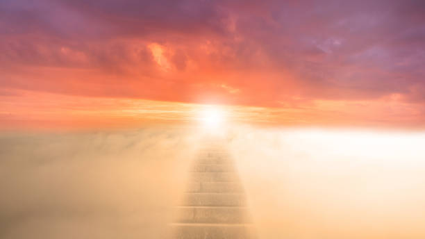 istock Stairway leading into a beautiful sunset above the clouds, symbolic image for dying 1357667836