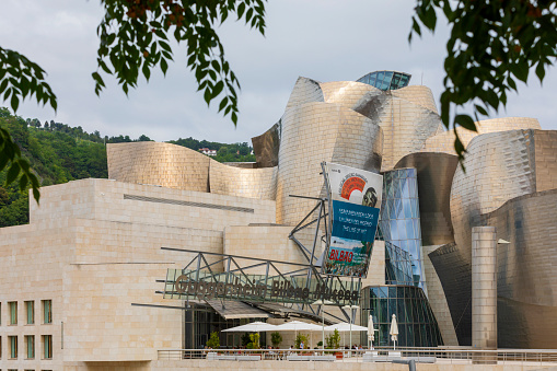 Bilbao, Spain - August 3, 2021: exterior of the Guggenheim Museum Bilbao, a museum of modern and contemporary art, designed by architect Frank Gehry in 1997