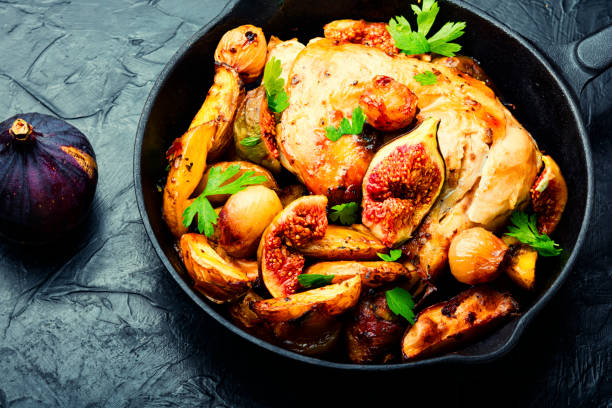 istock Chicken baked with potatoes and figs 1357668016