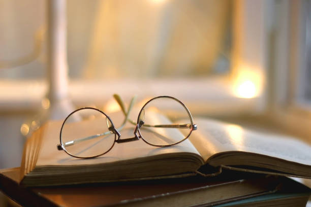 istock Book, Glasses and Candles 1357673291