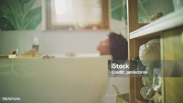 Beautiful African Ethnicity Woman Relaxing In Modern Bathroom Meditating In Hot Water Stock Photo - Download Image Now