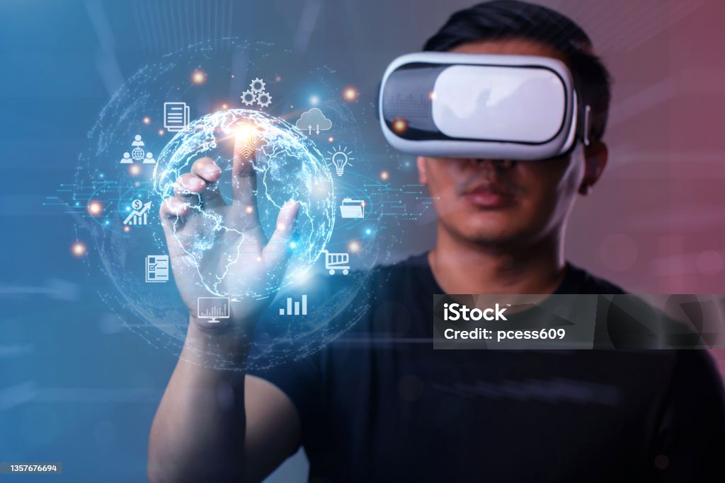 Metaverse and Future digital technology.Man wearing VR glasses hand touching virtual Global Internet connection metaverse.Global Business, Digital marketing, Metaverse, Digital link tech, Big data Metaverse Stock Photo
