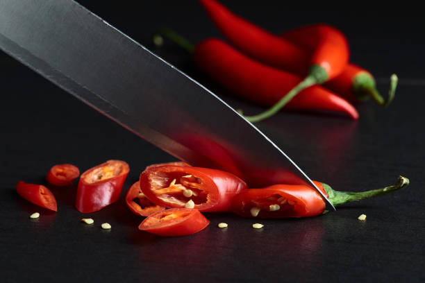 istock Knife cut red chili pepper. 1357678387