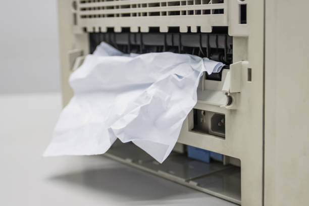 Paper Stuck, Paper Jam In Printer At Office concept office equipment problem stock photo