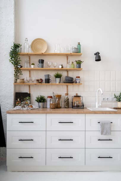 istock Wooden shelves in scandinavian kitchen interior design 1357679273