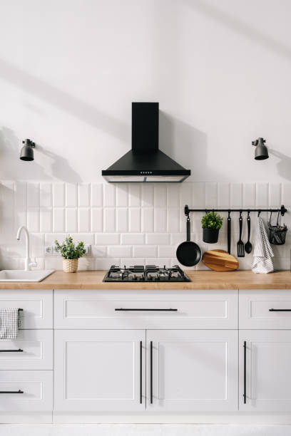 istock Hob and hood in cozy kitchen at modern kitchen 1357679280