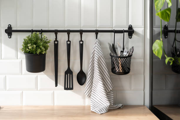 istock Modern kitchen cutlery hanging on white wall 1357679319