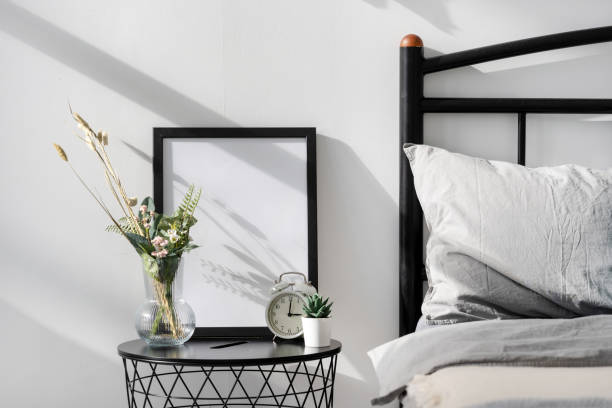 istock Home decor and picture frame with blank space on nightstand 1357679404