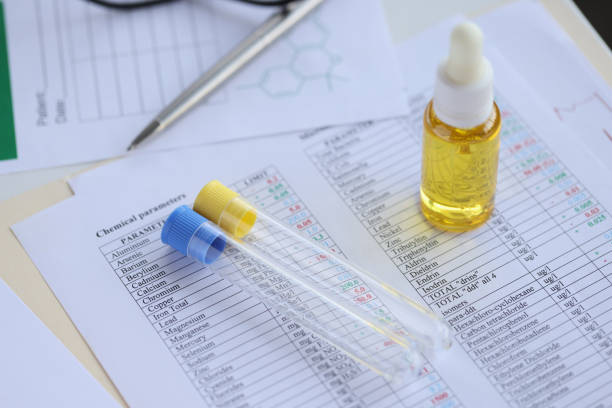 On table are test tubes and oil in bottle. Chemical composition of matter concept
