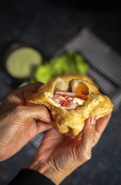 istock Homemade fried Neapolitan pizza with ham and cheese 1357683297