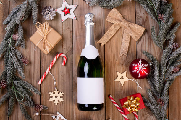 istock wine champagne bottle on a christmas party holiday table with empty label copy space 1357685016