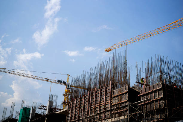 istock Engineer standing orders for construction crews to work on high ground heavy industry 1357685651