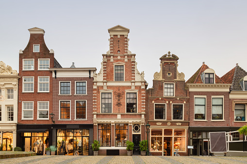 Afternoon view of the Dutch shopping street Mient in the historic city center of Alkmaar, The Netherlands