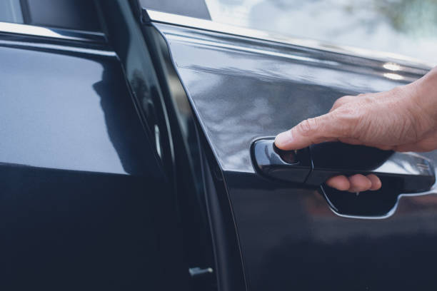 istock Opening car door 1357688795