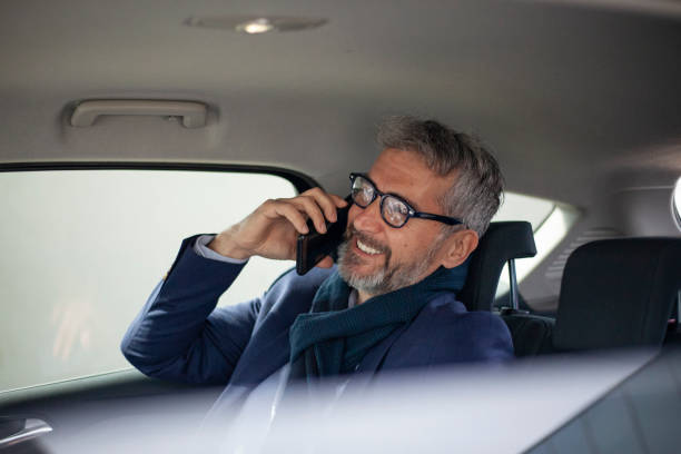 istock Senior busiessman in the car 1357688866