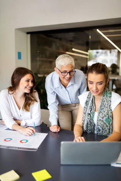 istock Group of business people working together in software development and designer office 1357691567
