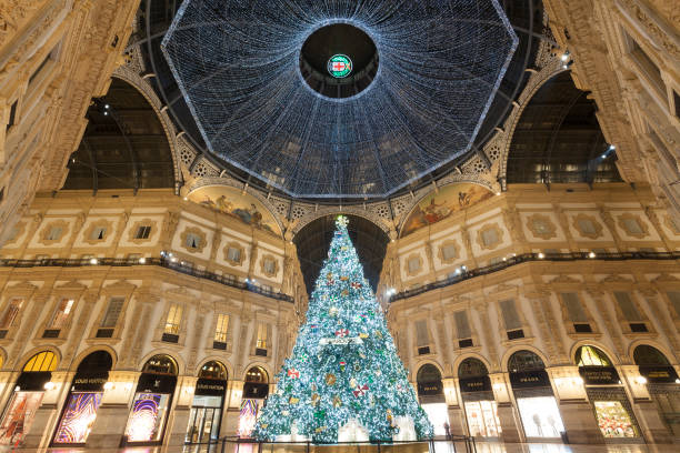 Milan, Italy - December 7, 2021: night street view of Milan with Christmas decorations in Piazza del Duomo.