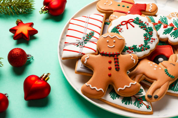 istock Christmas composition with decorations and cookies on a mint background 1357697652