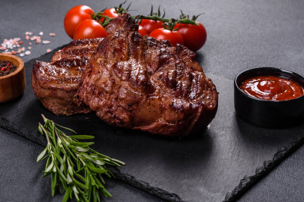 istock grilled beef steaks with spices on a dark cutting board 1357697756
