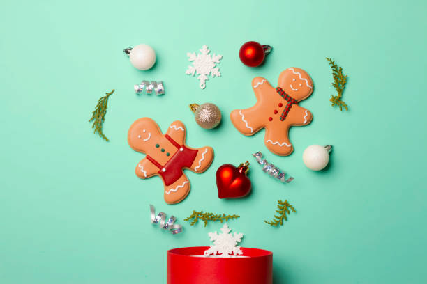 istock Christmas composition with decorations and cookies on a mint background 1357698470