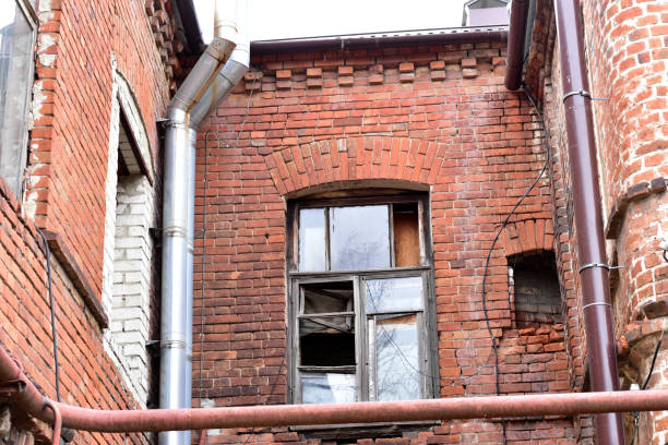 istock An old high-rise building built of red bricks. 1357698531