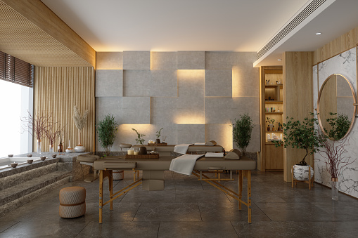 Interior de la sala de masajes del spa de lujo con mesas de masaje, bañera de hidromasaje y suelo de mármol. photo