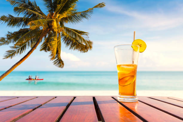 istock coconut palm trees and Juice drinks on a tropical beach. outdoor activities. 1357706341