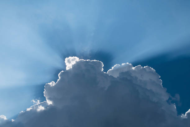 A streak of light shone from behind the clouds.