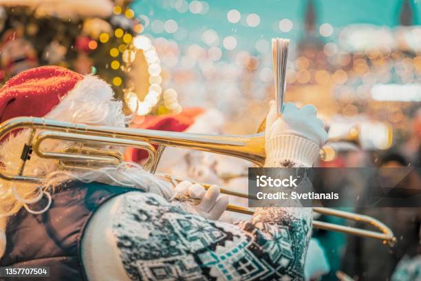 Performance Of Santa Claus Musician Christmas And New Year City Party Stock Photo - Download Image Now