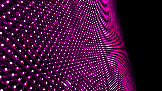 close up LED video screen showing bright purple light.  LED soft focus background. abstract technology or innovation background with blank space for design.