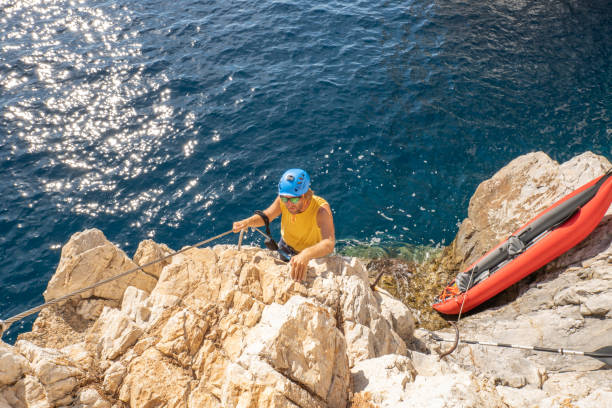 istock Climber on Via Ferrata above sea, young max 1357708674
