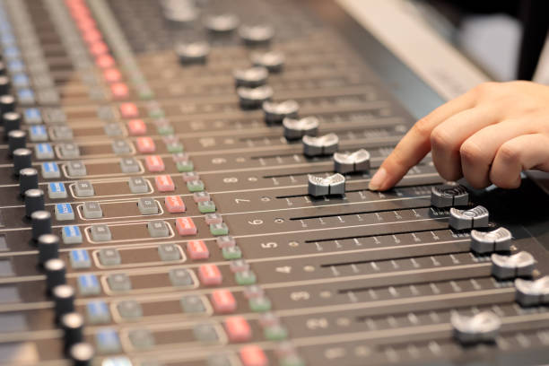 istock audio mixing console with hand of sound engineer 1357712760