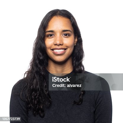 istock Studio portrait of a smiling young latin woman 1357723739