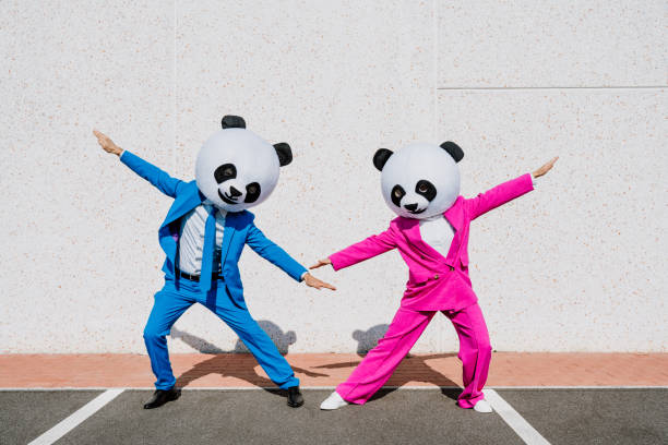 istock Storytelling image of a couple wearing giant panda head 1357724074