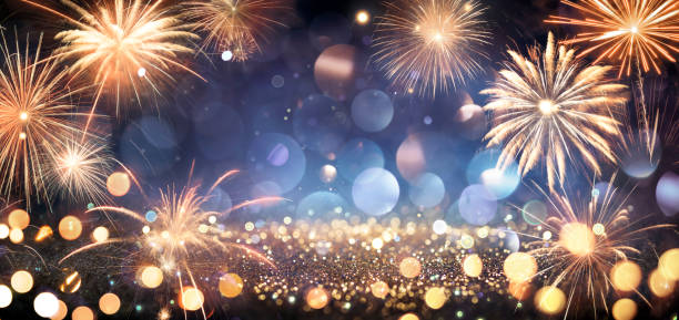 istock Celebration Anniversary - Golden Fireworks In Blue Night With Glitter - Abstract Defocused Texture 1357724187