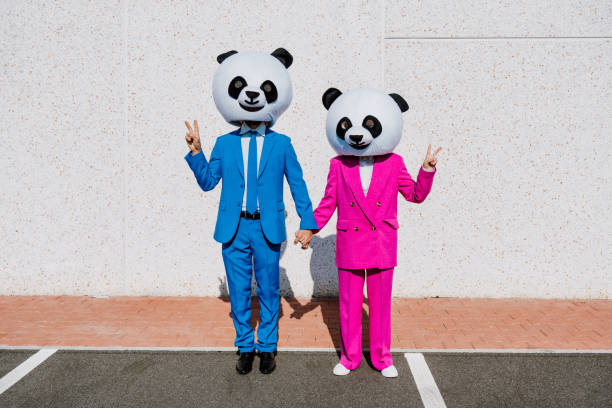 istock Storytelling image of a couple wearing giant panda head 1357724286