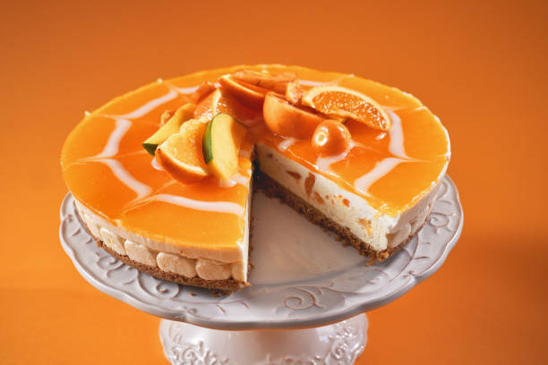istock Creamy Orange Cheesecake with Whipped Cream 1357725590
