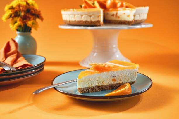 istock Creamy Orange Cheesecake with Whipped Cream 1357725593
