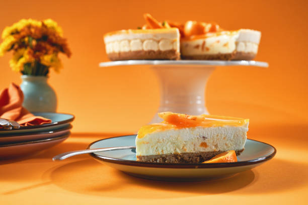 istock Creamy Orange Cheesecake with Whipped Cream 1357725594