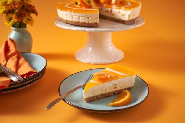 istock Creamy Orange Cheesecake with Whipped Cream 1357725596